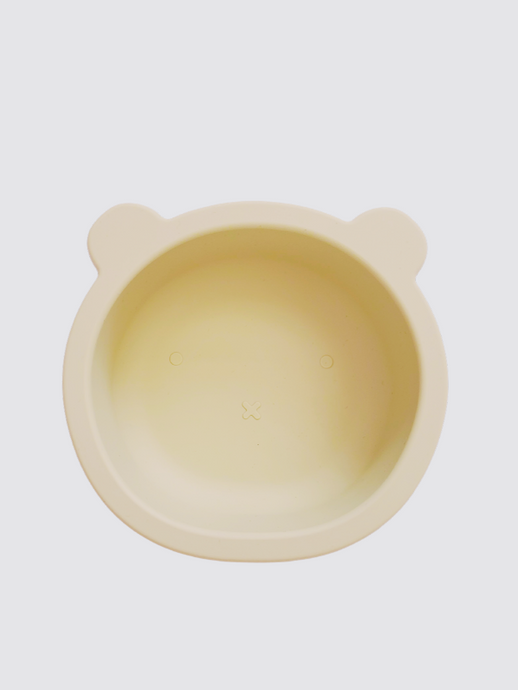 Wheat coloured silicone bowl, with suction cup base, in the shape of a bear's face.
