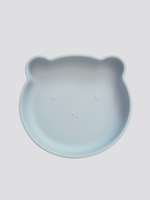 Grey blue silicone plate, with suction cup base, in the shape of a bear's face.