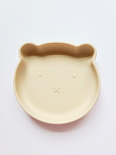 Charger l&#39;image dans la galerie, Wheat coloured silicone plate, with suction cup base, in the shape of a bear&#39;s face.
