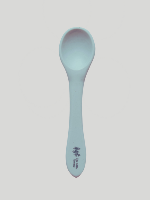 A small grey blue silicone spoon meant for use by babies and toddlers.