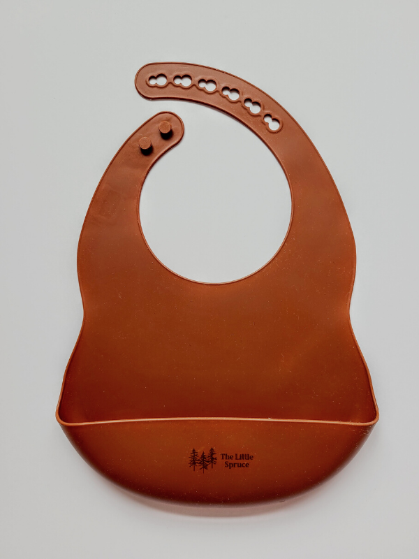 The Little Spruce silicone baby bib, clay
